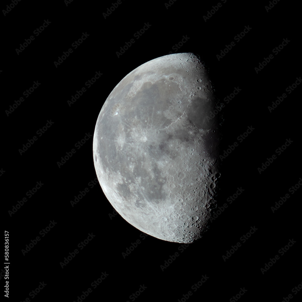 Third quarter moon in the night sky showing crater detail Third quarter moon in the night sky showing crater detail