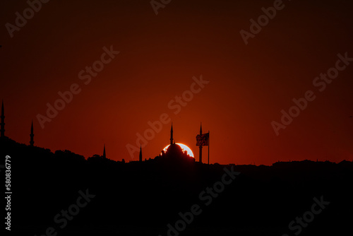 Silhouette of Fatih Mosque at sunset. Islamic or Ramadan background photo © senerdagasan