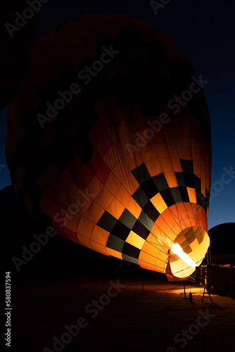 Inflating the balloon with fire at the sunrise to take off and see all of Cappadocia from the sky