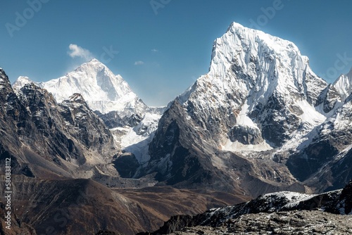 Snow covered peaks of Cholatse and Makalu in the background. Beautiful view from Renjo-La  while descending to Gokyo