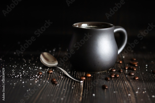 A cup of delicious morning coffee. Dark arrangement