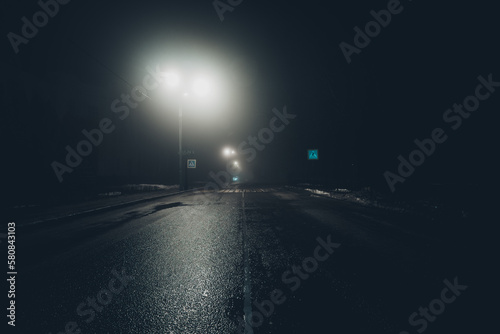 Dark foggy noire rainy street, empty road