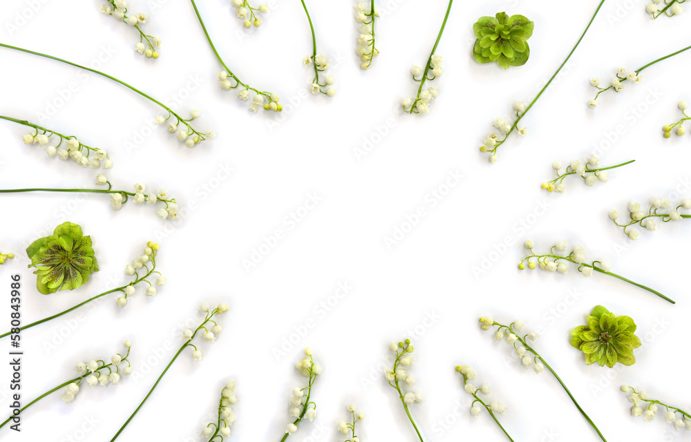 Frame with white flowers Lily of the valley ( Convallaria majalis, May bells, may-lily ), hellebores on white background with space for text. Top view, flat lay
