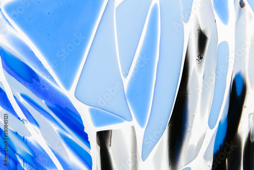 Blue white pattern of fused glass. Glass fusing abstract fragment