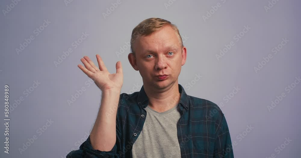 Be quiet. Man uses sign language zips mouth with hands asks to keep secret has mysterious Be quiet. Man uses sign language zips mouth with hands asks to keep secret has mysterious