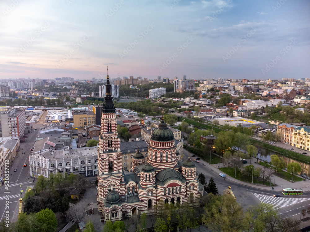Holy Annunciation Cathedral aerial view with sunset scenic cloudscape. Kharkiv city orthodox church in downtown, Ukraine