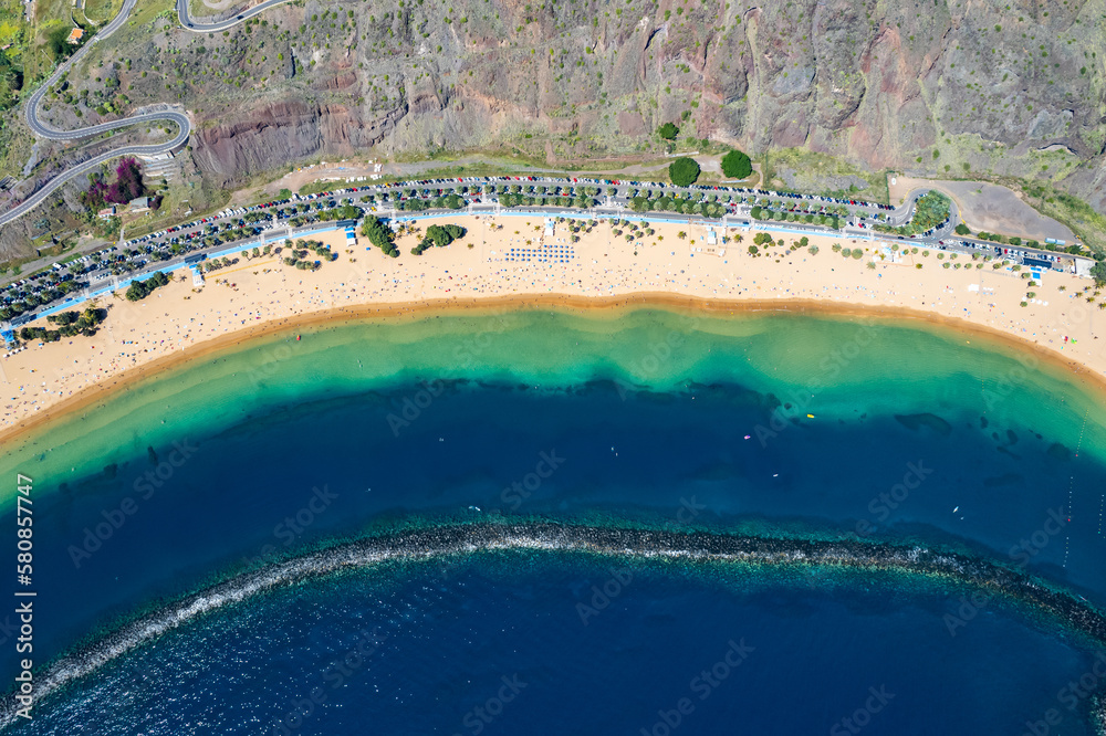 Aerial view above rainbow colored swimming beach - Playa de Las Teresitas - in San Andres Tenerife Canary Islands