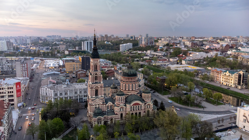 Holy Annunciation Cathedral aerial view with evening sunset scenic cloudscape. Kharkiv city orthodox church in downtown, Ukraine