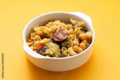 Traditional chickpeas dish in casserole in white bowl