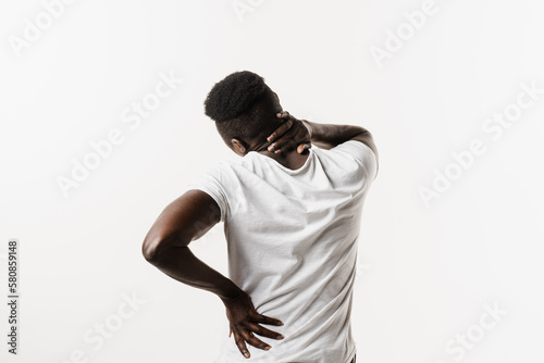Scoliosis is sideways curvature of the spine. Rheumatism and arthritis diseases. Rachiocampsis bachache and neck pain of african american man on white background. photo