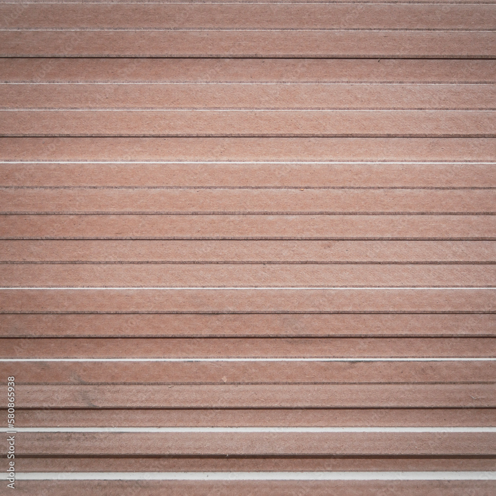 OSB sheets are stacked in a hardware store. The building material is wood. OSB sheets are stacked in a hardware store. The building material is wood.