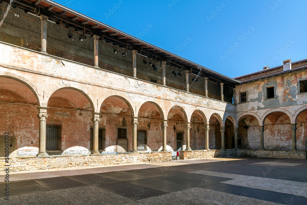 The two story cloister courtyard area of the 14th century Carmine Monastery in the historic Citta Alta upper town district of Bergamo, Italy.
