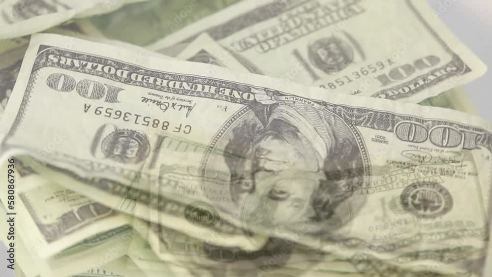 Animation of american dollar banknotes falling over american dollar banknotes spinning Animation of american dollar banknotes falling over american dollar banknotes spinning