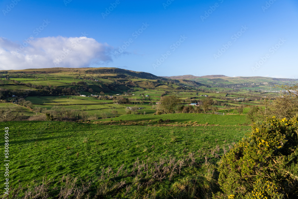 Rural landscape of green fields and rolling hills in Ireland