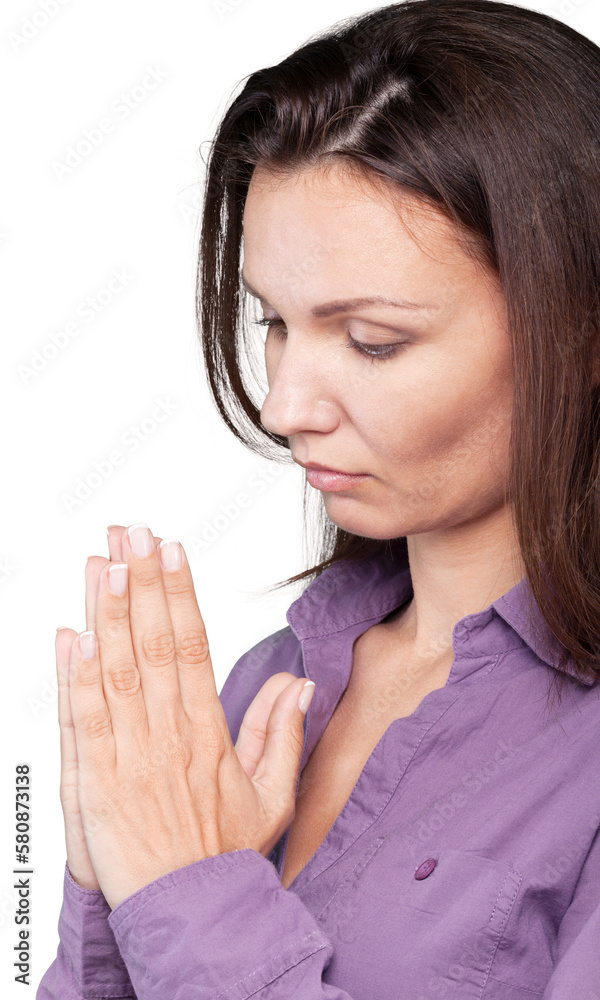 Serious young caucasian woman praying Serious young caucasian woman praying