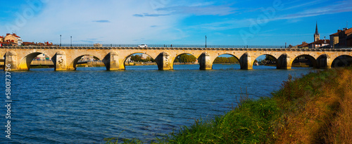 Panorama of bridge over Saona and loire river and riverside of Macon, France photo