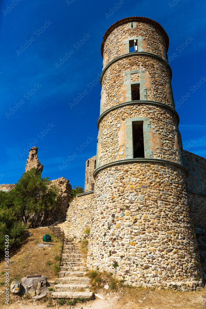 Landscape on a warm September day with a view of an ancient castle representing a medieval fortress in the village of ..Grimaud, France