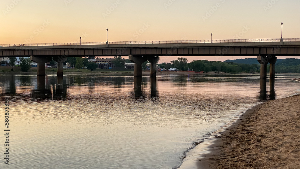 bridge over the river at sunset