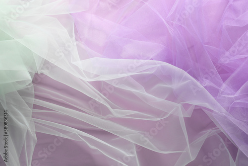 Beautiful tulle fabric on lilac background, flat lay