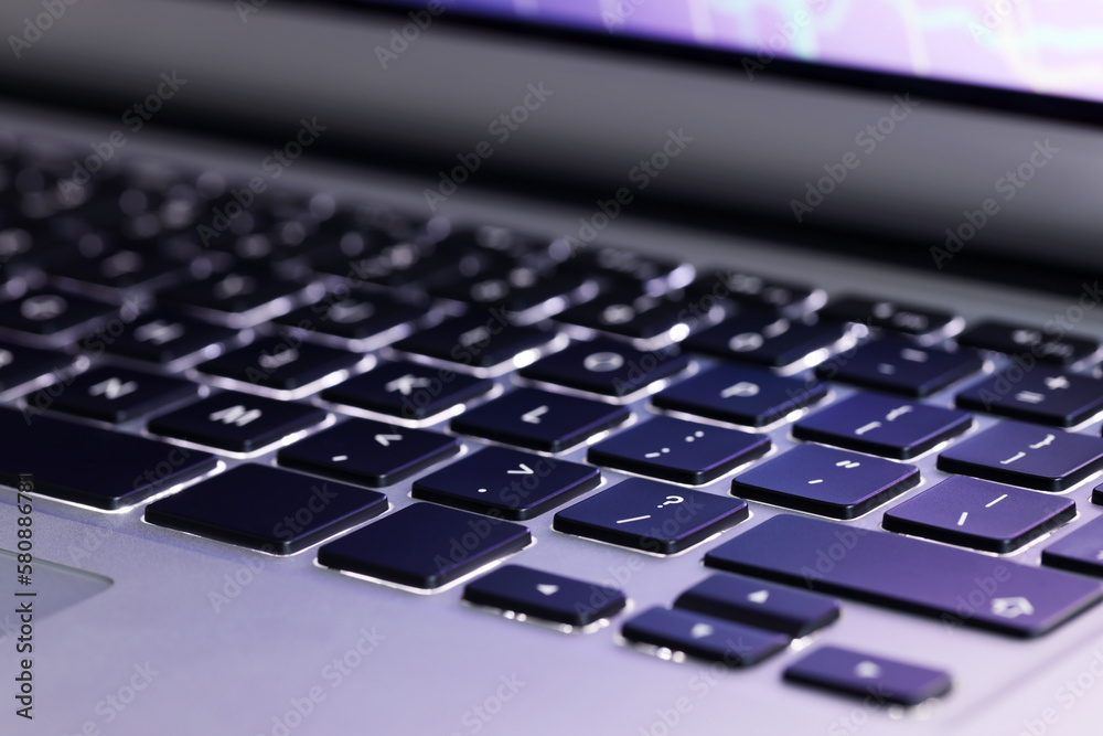 Closeup view of modern laptop keyboard as background