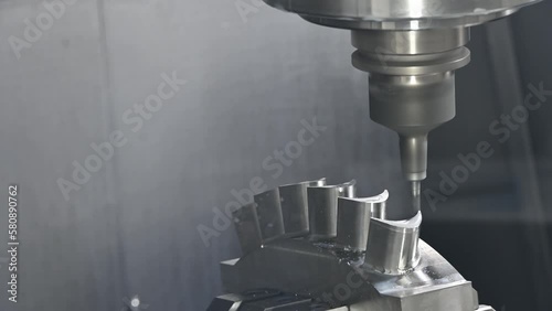 The 5-axis machining center cutting the water turbine blade part with ball end  mill tool.