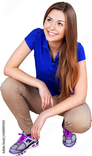 Fotografie Young woman in blue t-shirt isolated over white background