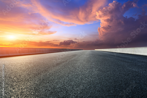 Asphalt highway and sky sunset clouds background © ABCDstock