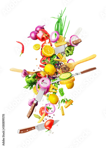Cooking concept. Vegetables, spoons and knives are flying isolated on white background. photo