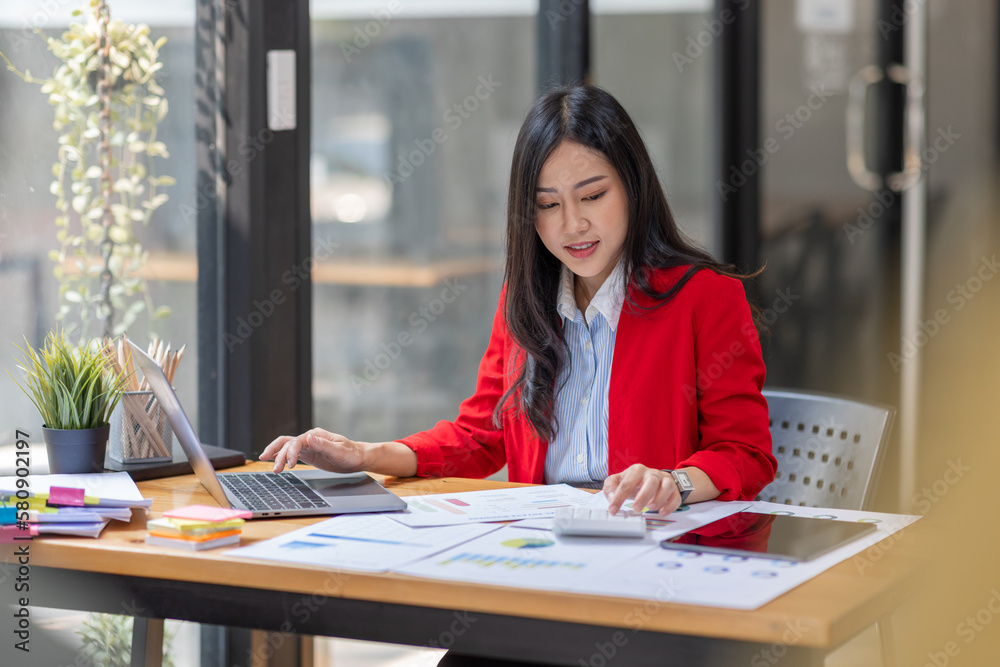 Businesswoman working at office with documents on desk, doing planning analyzing the financial report, Asian woman business plan investment, finance analysis concept Businesswoman working at office with documents on desk, doing planning analyzing the financial report, Asian woman business plan investment, finance analysis concept