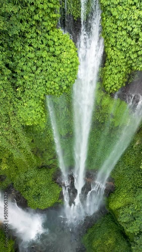 Sekumpul Waterfall is the largest and most beautiful waterfall in Bali. Indonesia. Shooting from the air. Vertical video