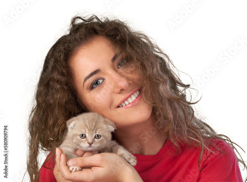 Obraz na plátně Happy young woman with a small amusing kitten