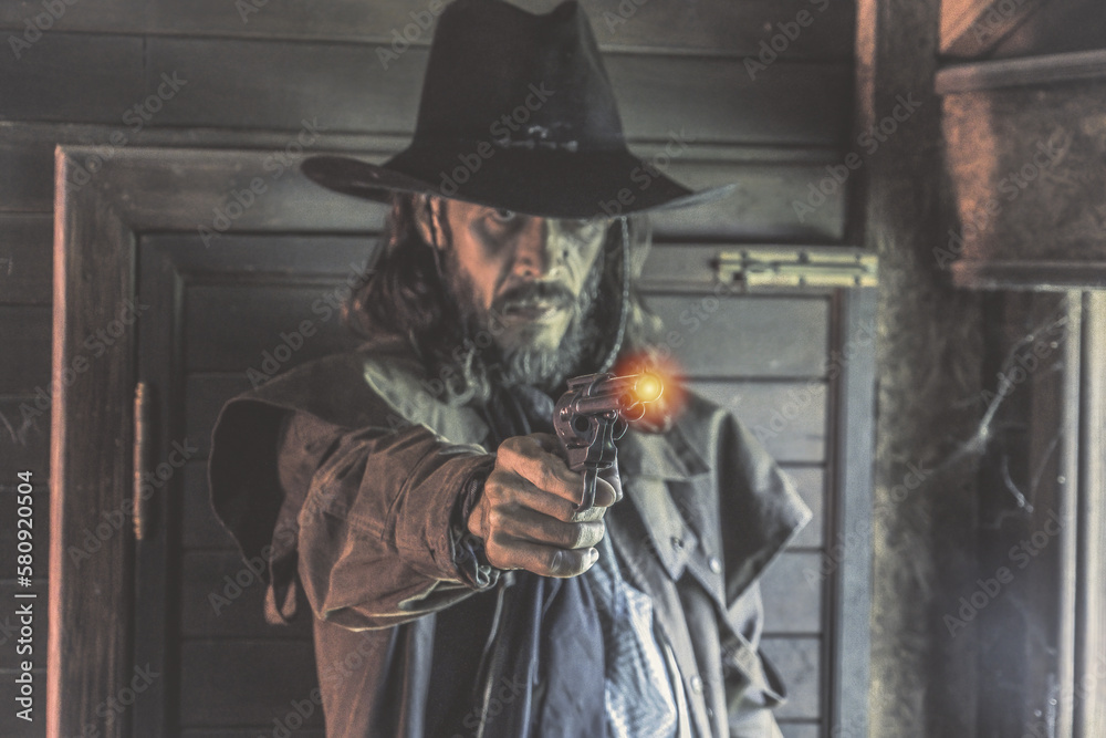 hand of cowboy holding gun. cowboy with gun prepares to gun fight.Cowboy. 