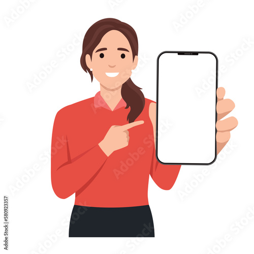 Woman showing blank smartphone screen and pointing on it.