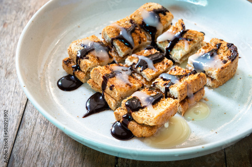 whole wheat slice bread toast Topped with chocolate sauce and condensed milk