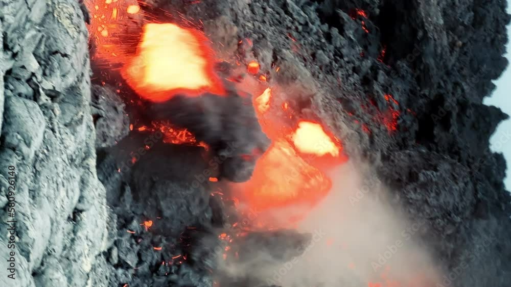 Vidéo Stock Epic vertical shot of huge rock falling down melted by red