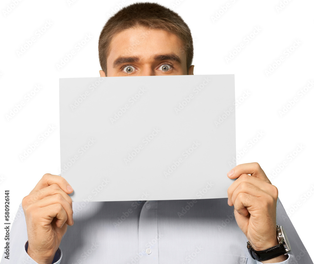 young man holding an empty banner over his face young man holding an empty banner over his face