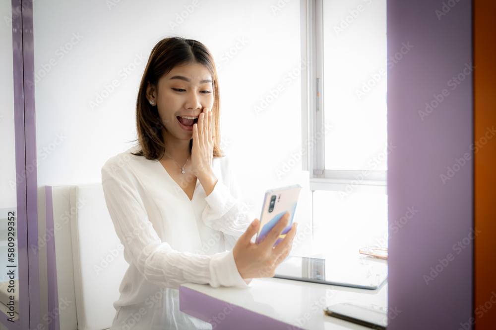Beautiful asian businesswoman excited about big bonus at work. Beautiful asian businesswoman excited about big bonus at work.