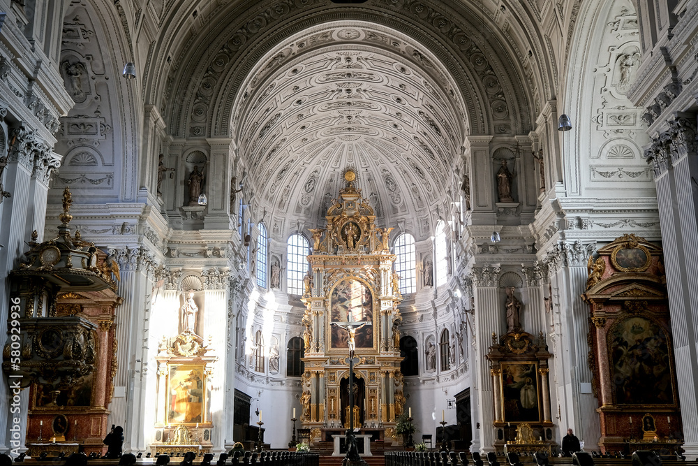 Magnificent opulent splendid Bavarian baroque church cathedral basilica interiors with stucco, murals, altar, Pilars, ceiling paintings, gold, wood domes nave