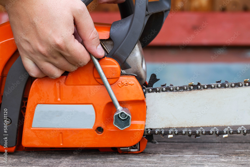Correct chain tension using the special tool on the chainsaw bar. Chain