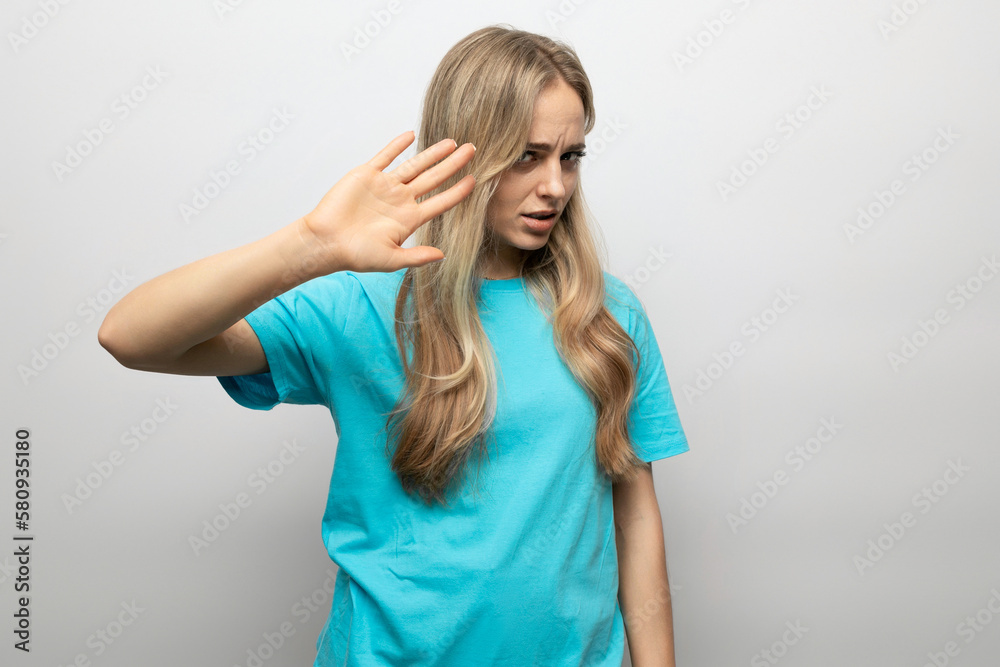 blond girl showing refusal on white background blond girl showing refusal on white background
