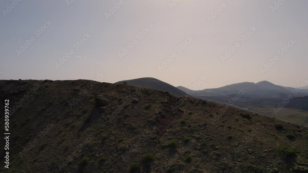 Aerial Flying Over Ridgeline TO Reveal Las Grietas Desert Hilly Landscape. Establishing Shot Aerial Flying Over Ridgeline TO Reveal Las Grietas Desert Hilly Landscape. Establishing Shot