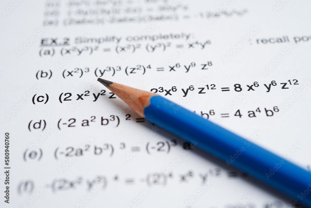 Pencil on mathematic formula exercise test paper in education school. Pencil on mathematic formula exercise test paper in education school.