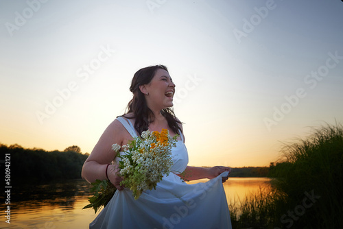 Принти на полотні Slavic plump plump chubby girl in long white dress on the feast of Ivan Kupala w