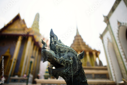 Close-up of Dragons sculpture against wat phra kaew at grand palace photo