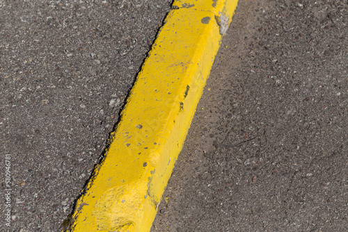 Yellow curb stone border © romantsubin
