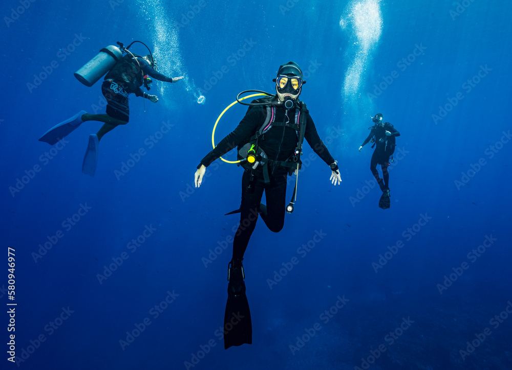 diver floating in the Banda Sea during mandatory safety stop diver floating in the Banda Sea during mandatory safety stop