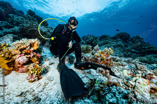 diver sits on the ocean floor at Banda Sea / Indonesia
