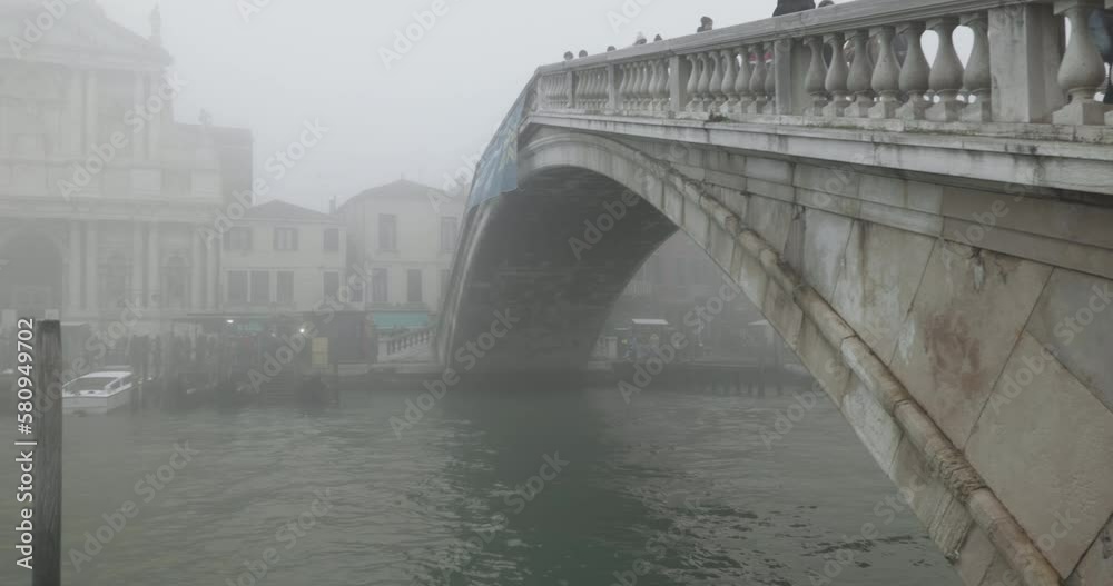 The Ponte Degli Scalzi bridge on Canal Grande in Venice on a foggy winter day The Ponte Degli Scalzi bridge on Canal Grande in Venice on a foggy winter day