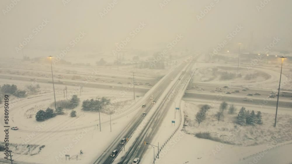 Winter Blizzard Over Highway With Low Visibility In Toronto, Ontario, Canada. aerial pan left