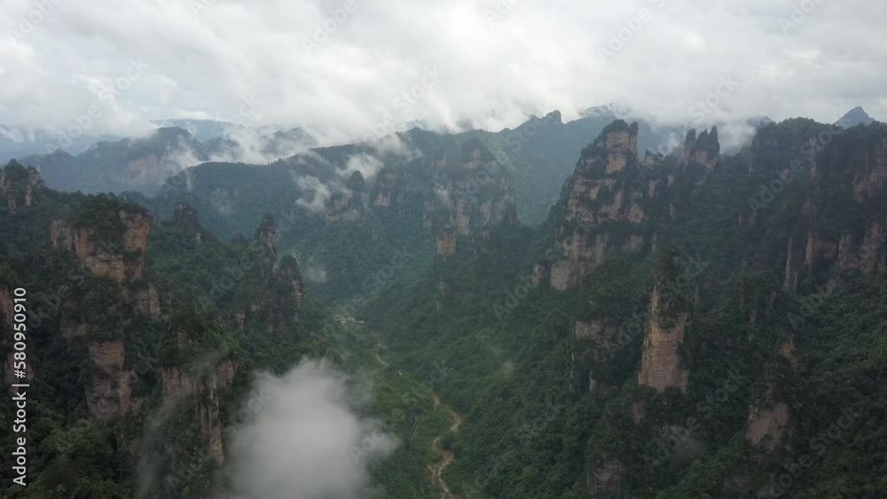 Stereotypical misty forest rock spire valley aerial in Hunan, China Stereotypical misty forest rock spire valley aerial in Hunan, China